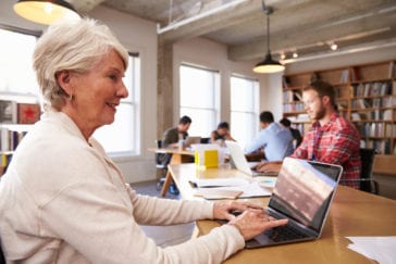 Senior Woman Doing Research on Laptop