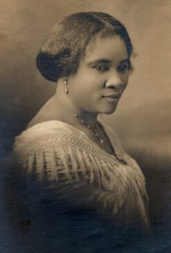 Madame CJ Walker Photo Portrait with her Hair Pulled Up Wearing Pearl Drop Earrings and Necklace Circa 1914