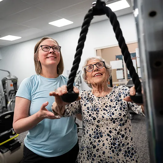 Edenwald_Programs-Events_Wellness An older woman participating in a physical therapy session